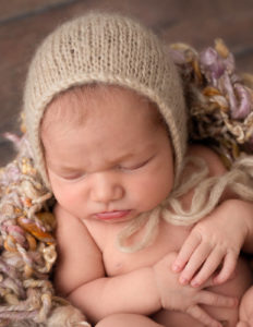 Sleepy newborn posed in Rochester, NY.