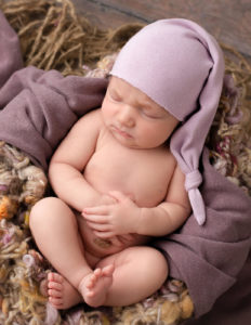 Gorgeous newborn posed wrapped in our Rochester, NY.