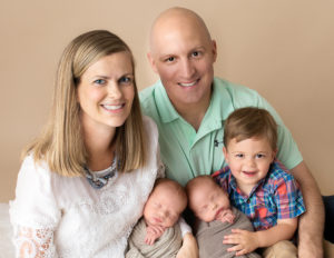 Family of 5 posed with their twin newborn boys in our Rochester, NY studio.