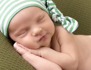 Cute newborn boy posed in our in home Rochester Ny studio.