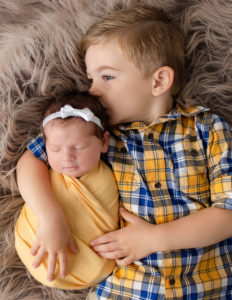 Siblings posed in our in-home Rochester, Ny studio.