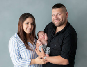 Family posed at our Rochester, NY studio.