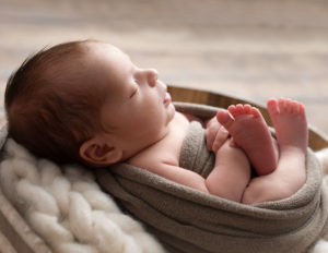 Sweet newborn profile in our Rochester, NY studio.