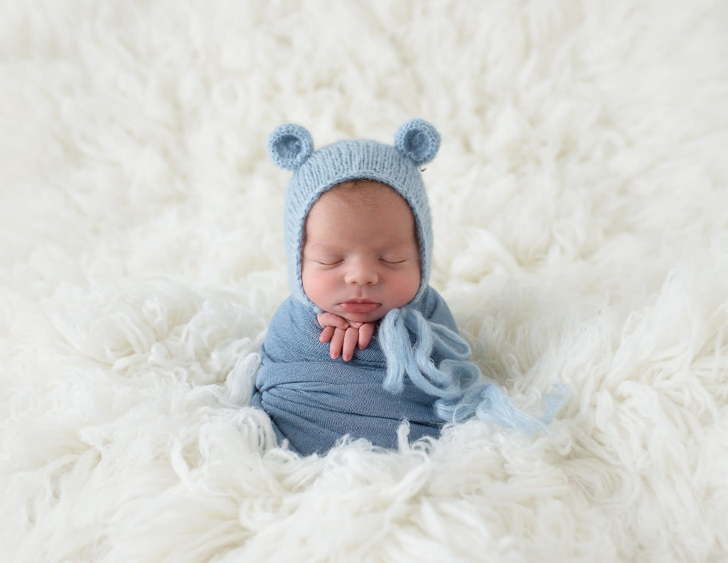 Newborn boy in potato pose at our in-home studio in Rochester, NY.