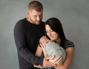 Family posed at our in-home Rochester, NY studio.