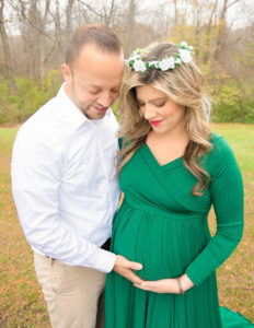 Parents to be posed at Basil Marella Park in Rochester, NY.