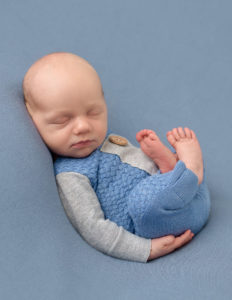 Sweet newborn boy posed in our studio in Rochester, NY.