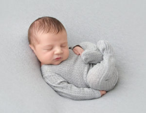 Precious newborn posed at our in-home Rochester, NY studio.