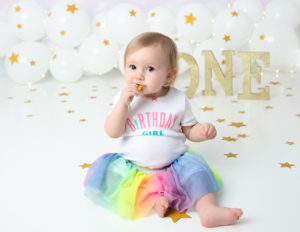 Sweet girl eating cake at our studio in Rochester, Ny.