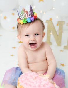 Smiling one year old posed in our Rochester, Ny studio.