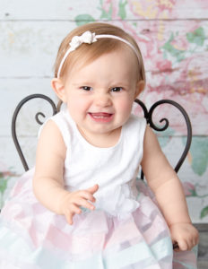 Cute girl posing at our studio in Rochester, NY.