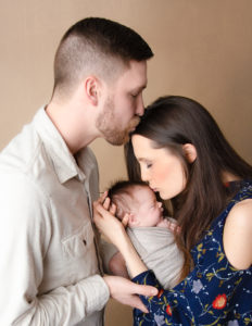 Family posed at our studio in Rochester, Ny.