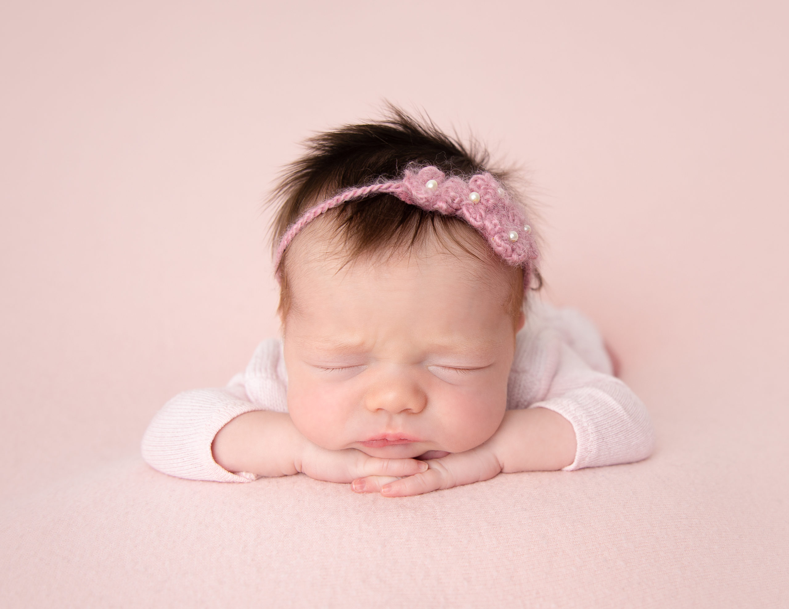 Pretty newborn posed at our studio.