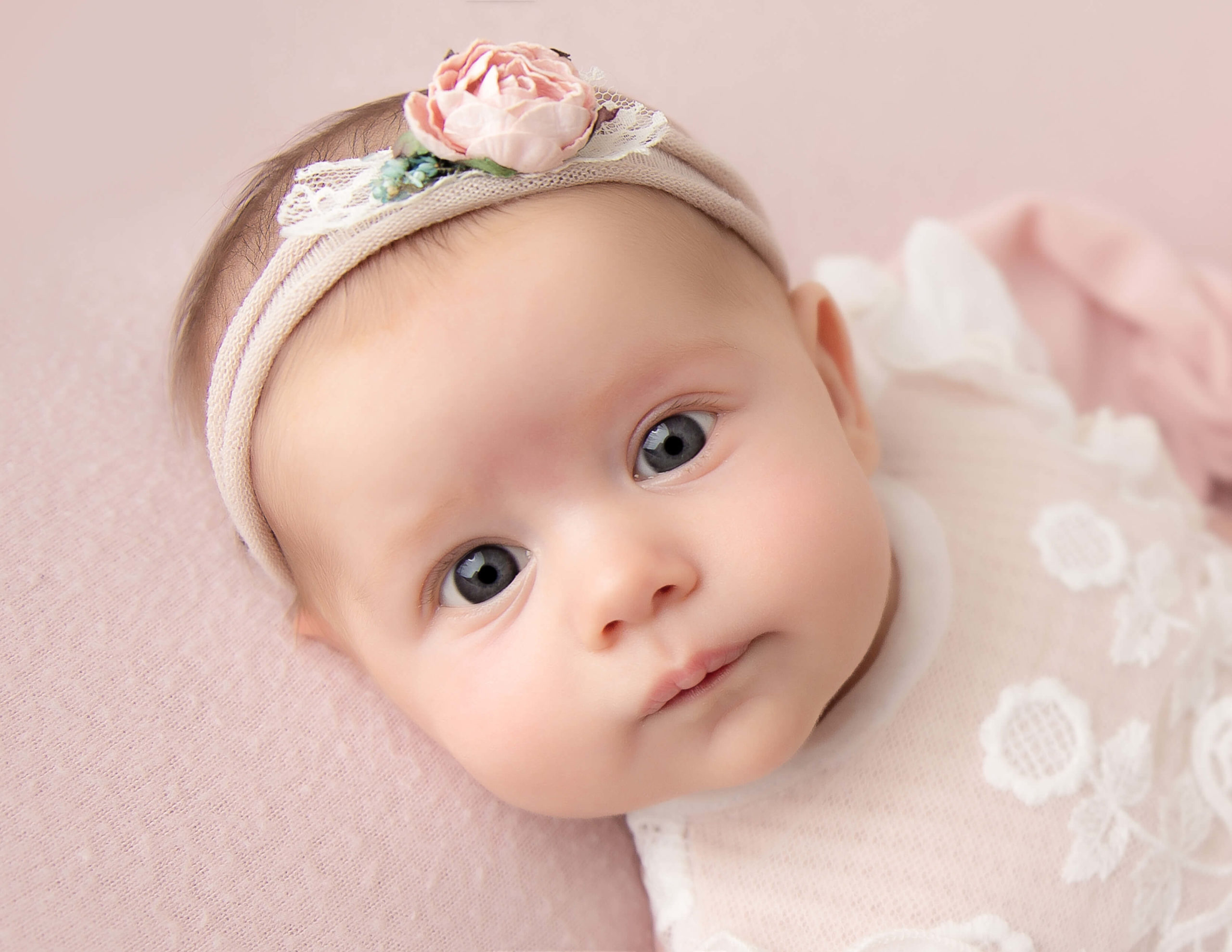 Awake newborn boy posed at our Rochester, NY studio.