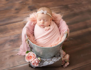 Sleeping 2 month newborn girl at our in-home Rochester, Ny studio.