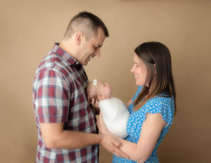 Parents posed at our studio in Rochester, NY.