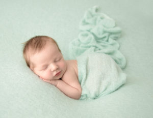 Sleeping newborn boy at our Rochester, Ny studio.