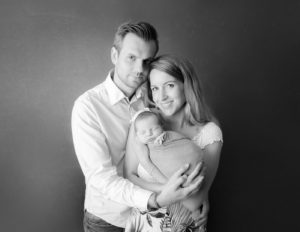 Family posed at our in-home Rochester, NY studio.