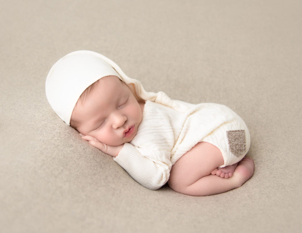 Handsome baby boy posed at our Rochester, NY studio.