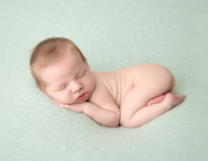 Handsome baby boy posed at our Rochester, NY studio.