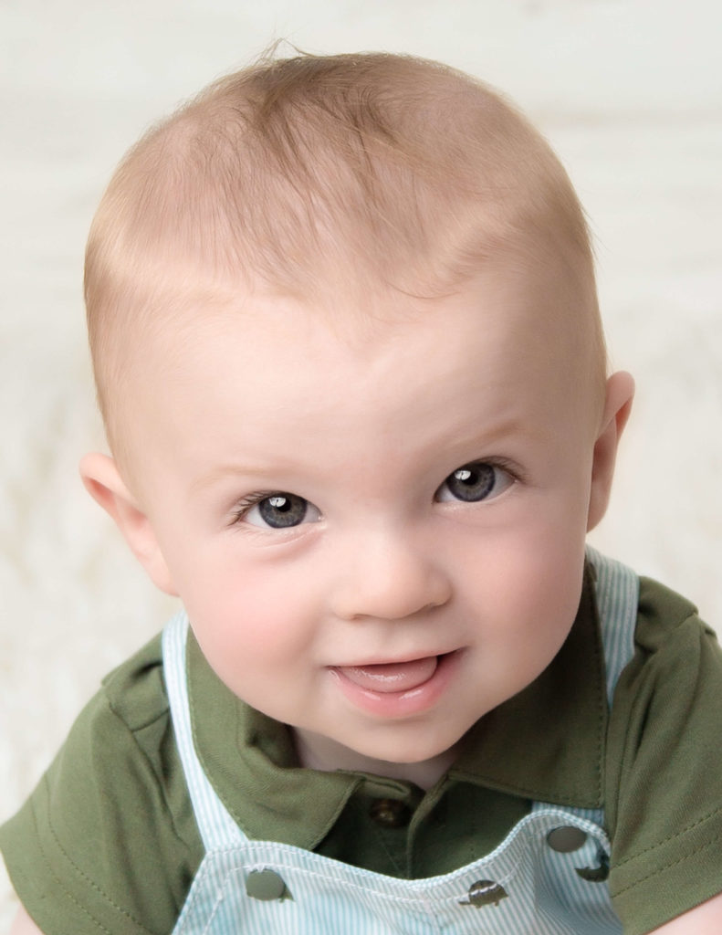 Cute six month milestone posed at our Rochester, NY studio.