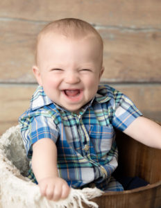 Baby boy smiling at our Rochester, NY studio.