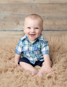 Baby boy smiling at our Rochester, NY studio.