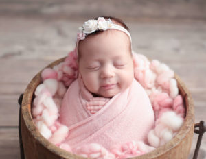 Sweet newborn girl sleeping at our studio in Rochester, NY.