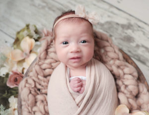 Awake baby girl at our Rochester, NY photography studio. 