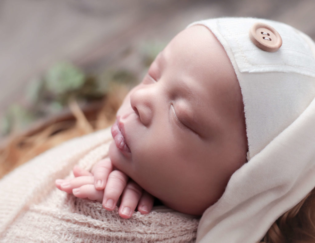 Newborn boy posed at our in-home Rochester, Ny studio.