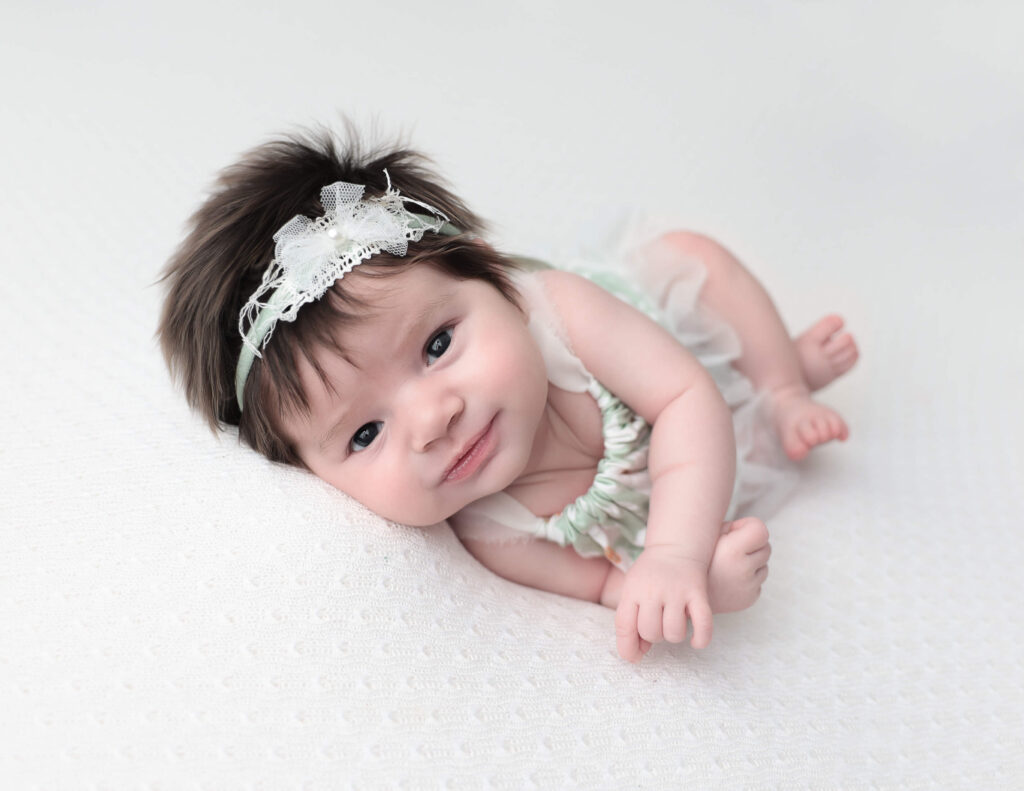 Adorable newborn photography with a headband 