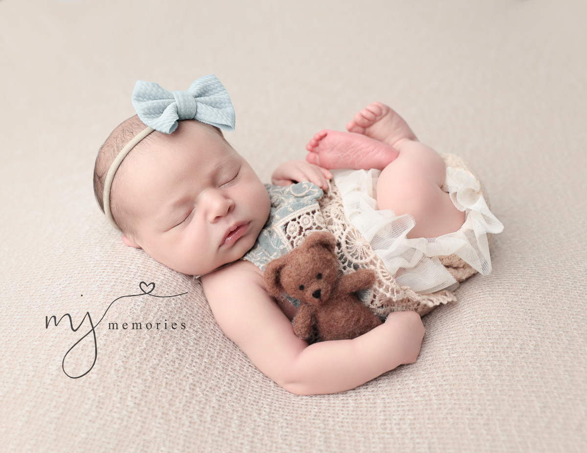 Sleeping baby girl posed at our Rochester, NY studio.