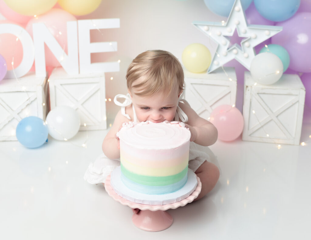 Pastel rainbow cake smash in our studio in Rochester, NY.