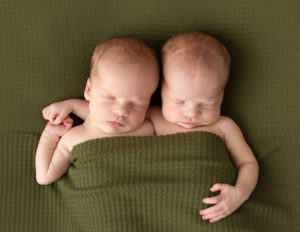 Twin newborn boys posed in studio in Rochester, NY.