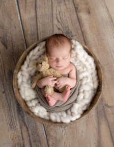 Newborn boy posed in our in-home Rochester, NY studio.