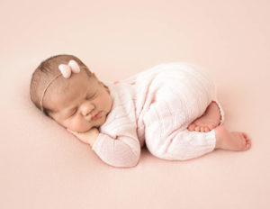 Sleepy baby girl posed in our studio in Rochester, NY.