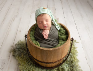 Handsome newborn boy posed in our studio in Rochester, NY.