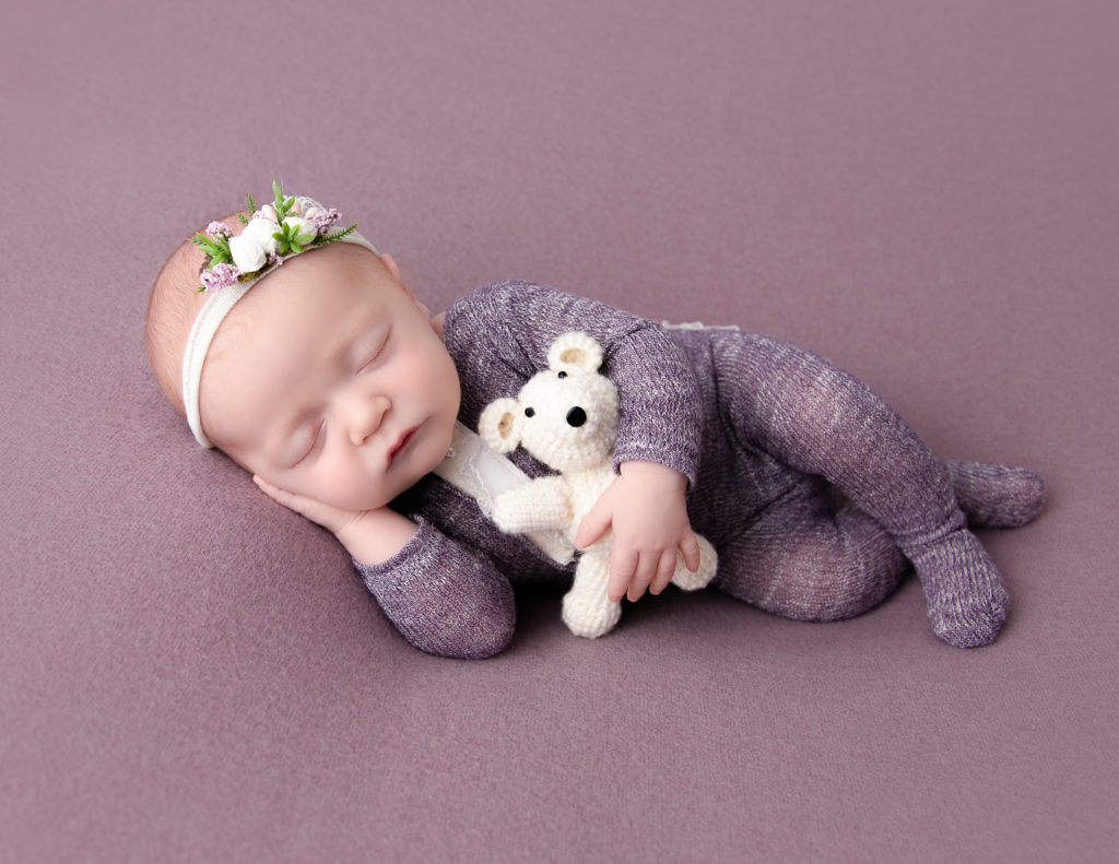 Adorable newborn girl sleeping in our studio in Rochester, NY.