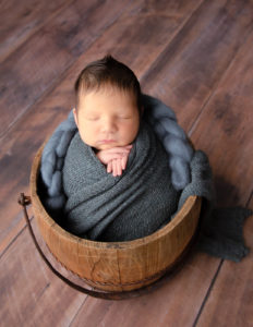 Precious newborn boy posed at our in-home studio in Rochester, NY.