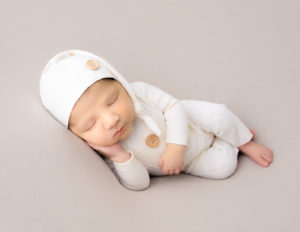 Cute newborn boy posed at our in-home studio in Rochester, NY.