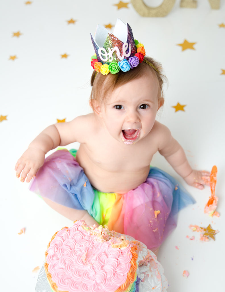 Precious girl at her cake smash in our Rochester, Ny studio.