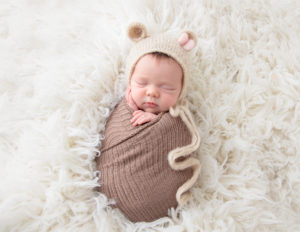 Cute newborn posed at our in-home studio.