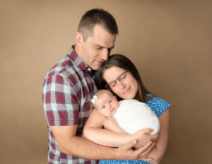Family posed at our Newborn studio in Rochester, NY.