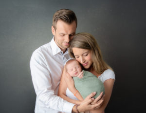 Family posed at our in-home Rochester, NY studio.
