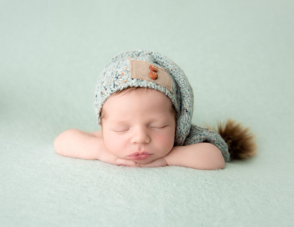 Posed newborn boy at our studio in Rochester, NY.