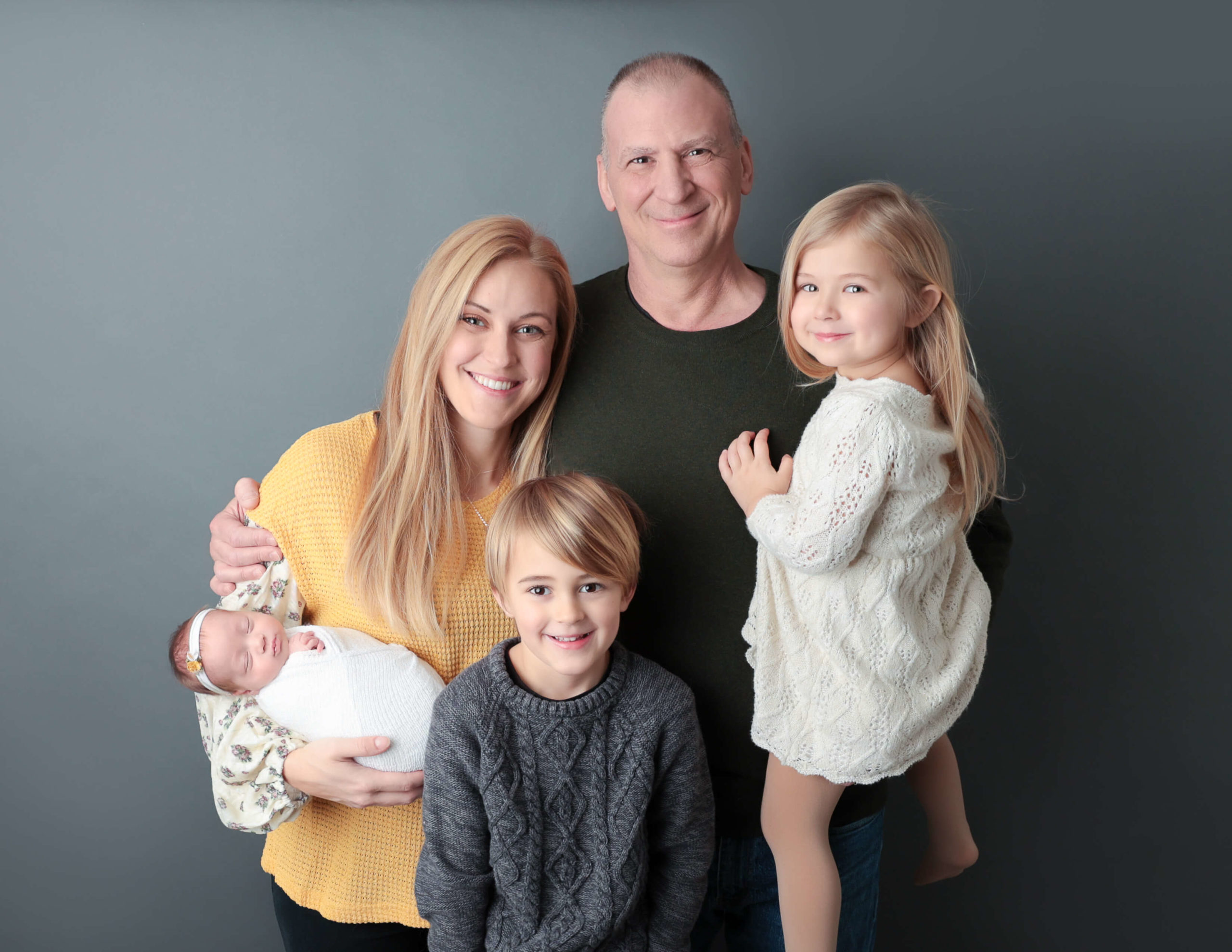 Family posed at our Rochester, NY studio.