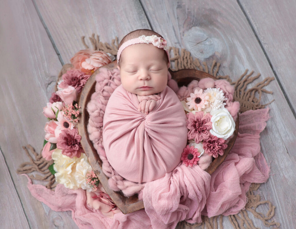 Newborn photography with a basket prop